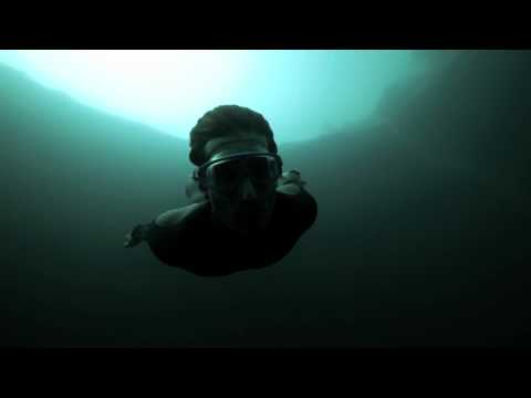 Guillaume Nery base jumping at Dean&#039;s Blue Hole, filmed on breath hold by Julie Gautier